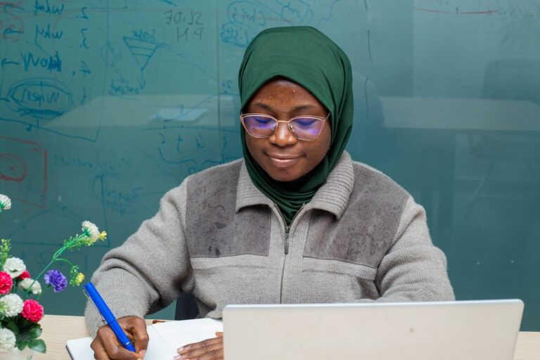 Faculty member reviewing course materials and grading workload